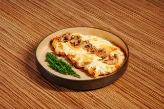 Schnitzel with cheese and mashrooms
