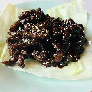 Tiras de solomillo de ternera caramelizado a la naranja con miel