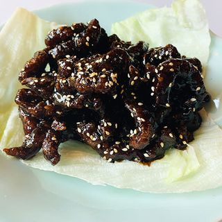 Tiras de solomillo de ternera caramelizado a la naranja con miel