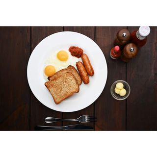 Two Eggs With Toast And Bacon Or Sausage