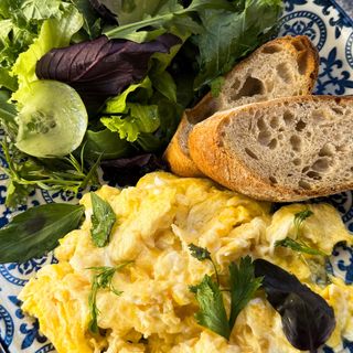 Scramble, fresh salad, toasted bread