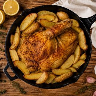 Mezzo pollo con porzione di verdure