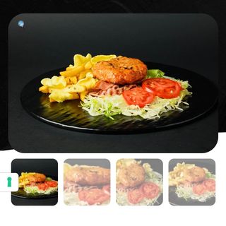 Hamburger di manzo al piatto con patate fritte