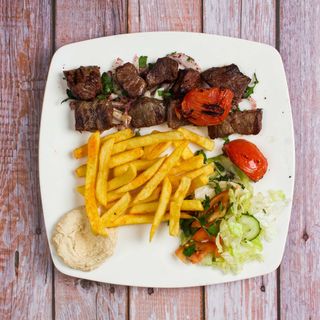 Pan fried goats meat with chips