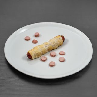 Würstel in carrozza