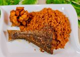 Jollof Rice + Croaker fish in stew+plantain 