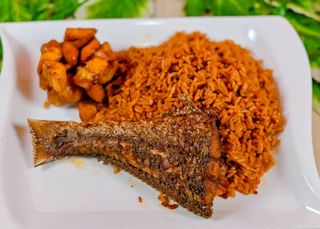 Jollof Rice + Croaker fish in stew+plantain 