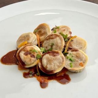 Raviolo anatra e arancia