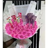 Hand bouquet of pink roses with chocolates and cash