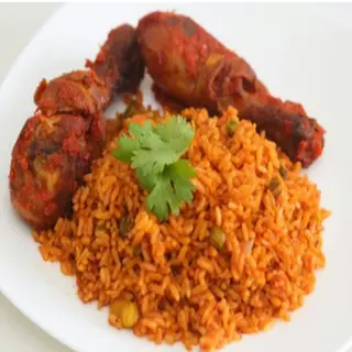 Jollof rice, chicken and salad