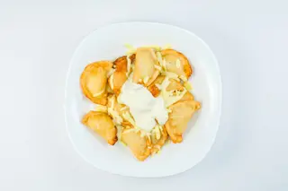 вареники жареные  под сырным соусом (300 гр.)