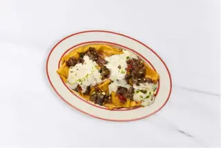 Паста с томленой кониной, фисташками и муссом из курта