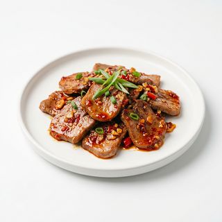 Lengua de cerdo salteada picante