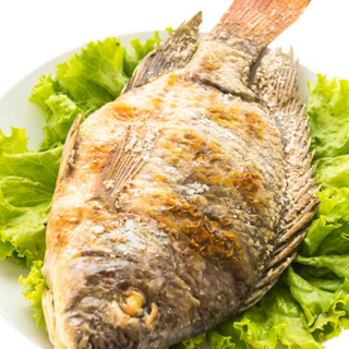 Tilapia -  Serving Ugali, greens