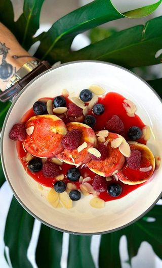 Syrniki with berry sauce and nuts