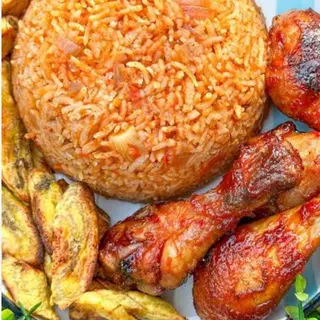 Jollof rice, plantains and peppered chicken 