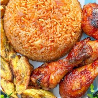 Jollof rice, plantains and peppered chicken 
