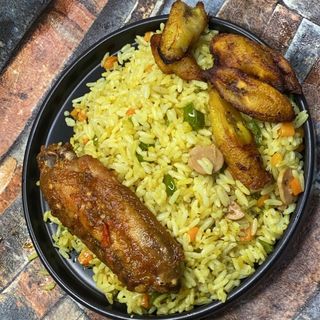  Well garnished Fried rice served with turkey and plantain 