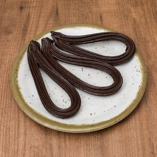 Churro bañado en chocolate