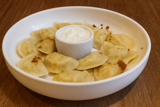 Картопляні вареники зі сметаною 250г