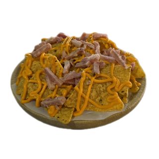 Nachos con cheddar y bacón