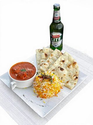 Chicken Tikka Masala and Biriani rice and Naan+ Castle Lite