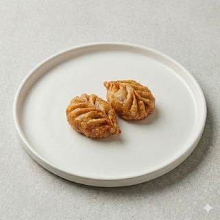 Momos  fritos carne