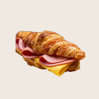 Croissant planchado con jamón y queso 