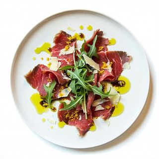 Carpaccio di manzo Rizzieri, rucola, grana e olio evo