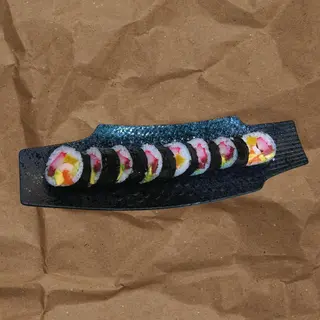 87. Futomaki Rellena De Atún, salmón y pez mantequilla (8 Pzs.)
