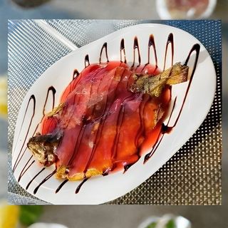 კალმახი შემწვარი ბროწეულის სოუსით