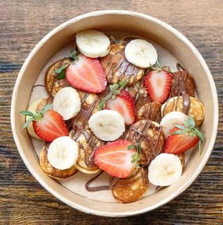 Pulled pork burger with side of pickels
