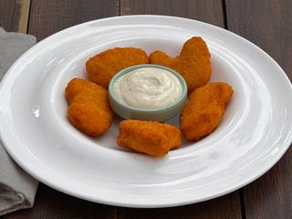 Курячі наггетси з соусом  / Nuggets di pollo con salsa al formaggio (120g)