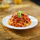 Minced meat Spaghetti served with a soda