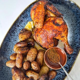1/2 Pollo + patatas asadas