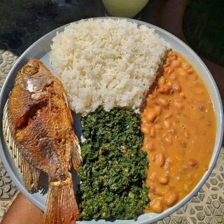 Rice, coconut beans, fried fish and greens 