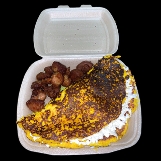 Cachapa grande con queso y cochino frito 