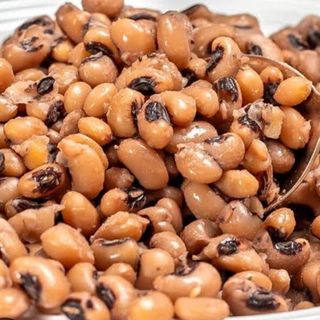 Boiled Red oloyin beans mixed with spicy Nigerian stew