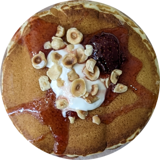 Pancake with strawberry jam and sour cream 