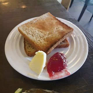 A toss of bread with butter & jam
