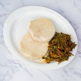 Yam And Vegetable Sauce. Sauce Is Made Of Ugba