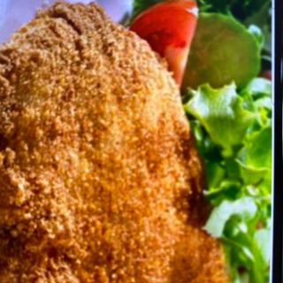 Filete de pollo empanado relleno de gambas 