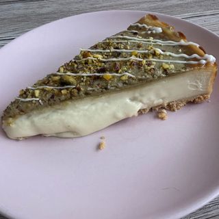 Cheesecake de pistacho (porción)