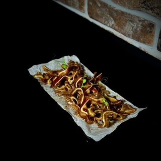 Свинячі вушка в соусі (120г)