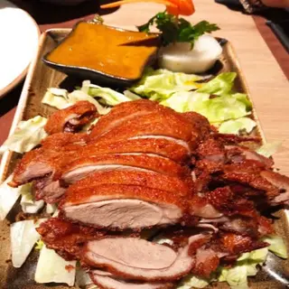 Pato asado con curry amarillo