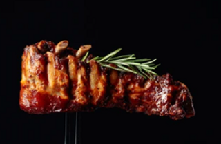 Costilla De Cerdo Al Carbón