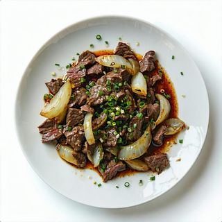 32. Manzo con cipolle