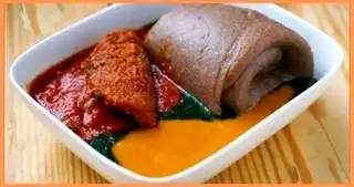 Amala served with Ewedu and Gbegiri mixed with shaki