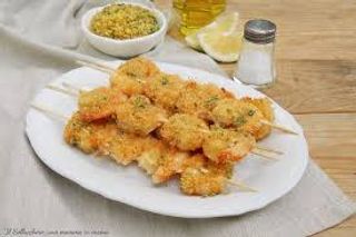 Spiedini di gamberi gratinati al forno