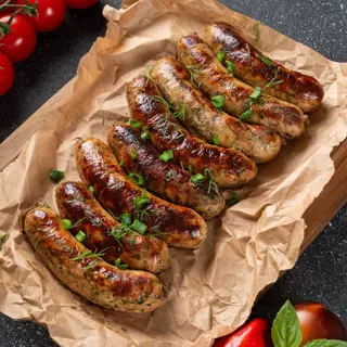 Ковбаски курячі з зеленню (95г)